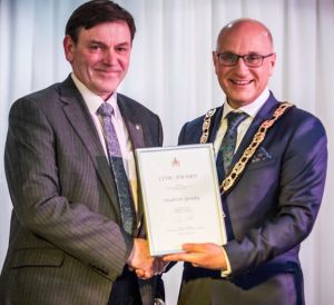 Andrerw receiving his award from Cllr Charles Goldstein, Mayour of Hertsmere Borough Council 2017-18